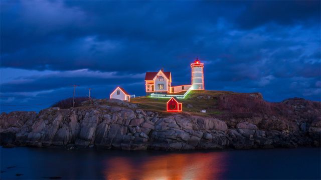 Holiday lights on Cape Neddick Light in York, Maine