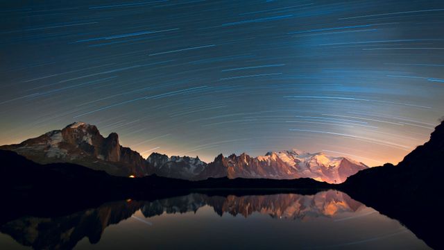 Star trails and mountain reflections, Mont Blanc Massif, French Alps, France
