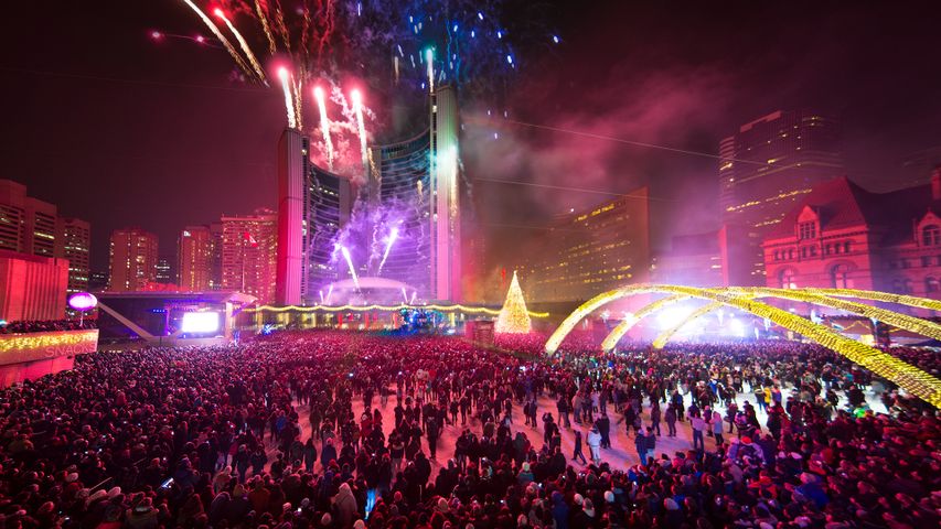 People watch the Christmas lights and fireworks at the Nathan Phillips Square in Toronto on November 30, 2013