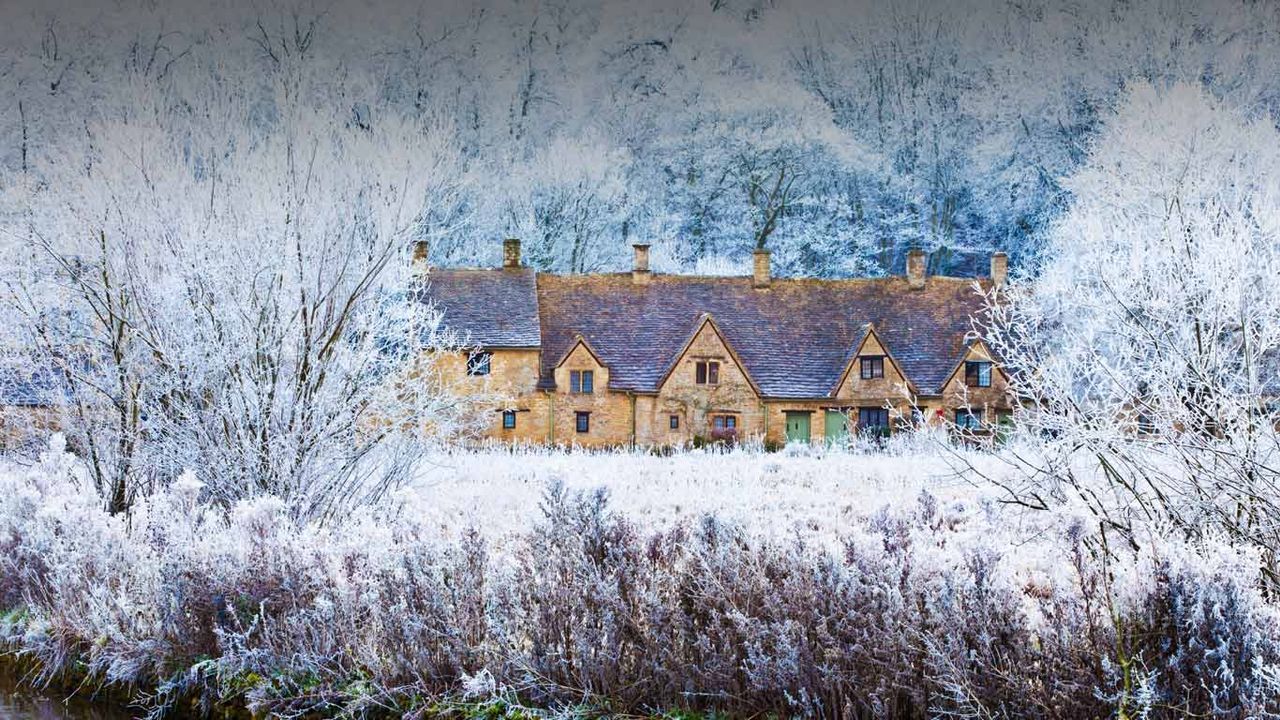 Houses beside the River Coln in Bibury, Gloucestershire 