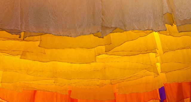 Skeins of fabric hung out to dry in the dyers' souk, Marrakech, Morocco