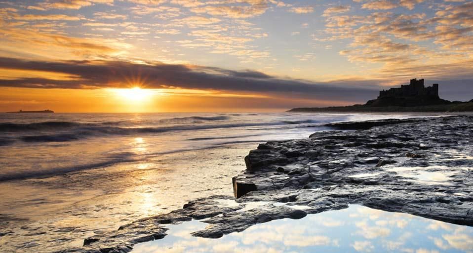 Spectacular sunrise on the coast near Bamburgh Castle, Northumberland, England