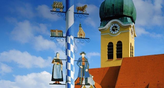 Maypole in front of a church in Wolnzach, Bavaria, Germany