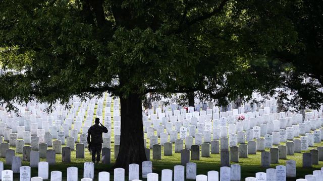 The 3rd US Infantry Regiment honors America's fallen soldiers during the 'Flags In' ceremony for Memorial Day, Arlington National Cemetery, Virginia 