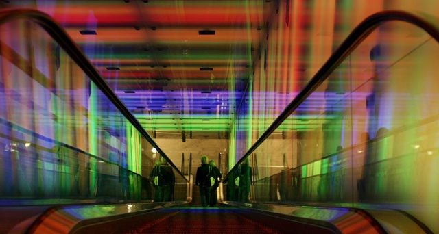 Escalator through the “Tunnel of Light” installation at the Nydalen Metro Station in Oslo, Norway