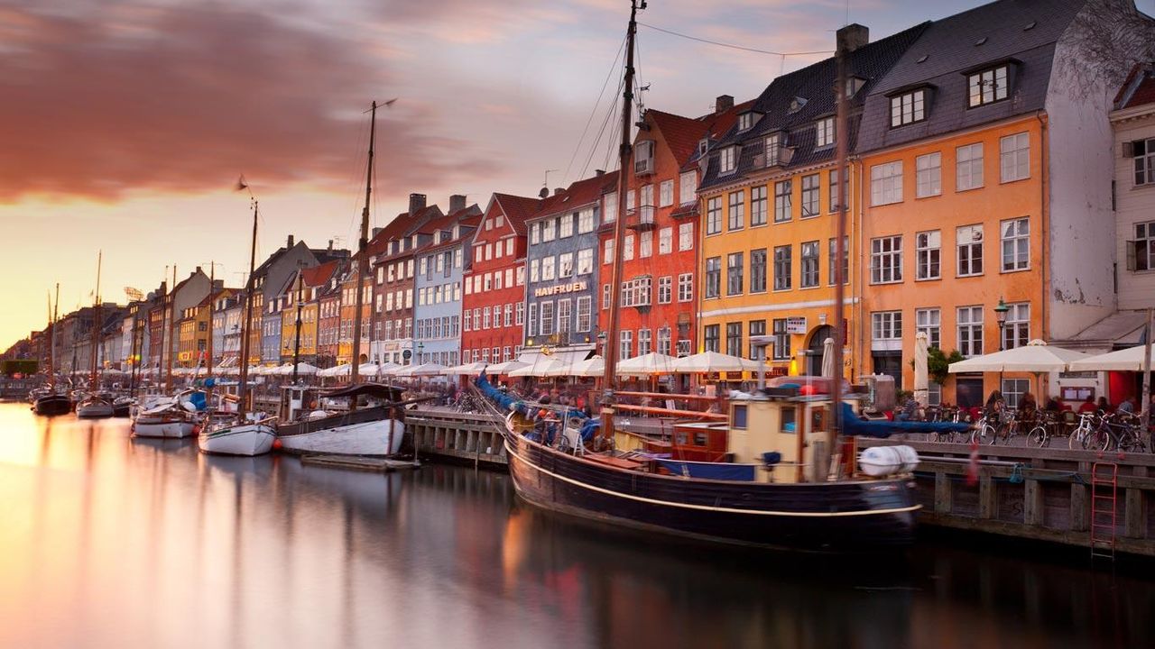 Colorful homes line Nyhavn Canal in Copenhagen, Denmark