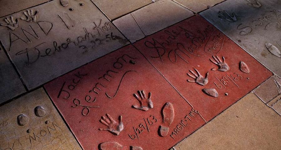 The hand and shoe prints of Jack Lemmon and Shirley MacLaine decorate the cement courtyard of Grauman's Chinese Theater on Hollywood Boulevard
