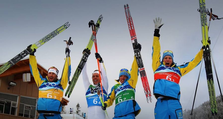 (L-R) Anders Soedergren, Marcus Hellner, Johan Olsson and Daniel Richardsson of Sweden celebrate winning the gold medal during the Men’s Cross Country 4 x 10 km relay at the 2010 Vancouver Winter Olympics on February 24, 2010