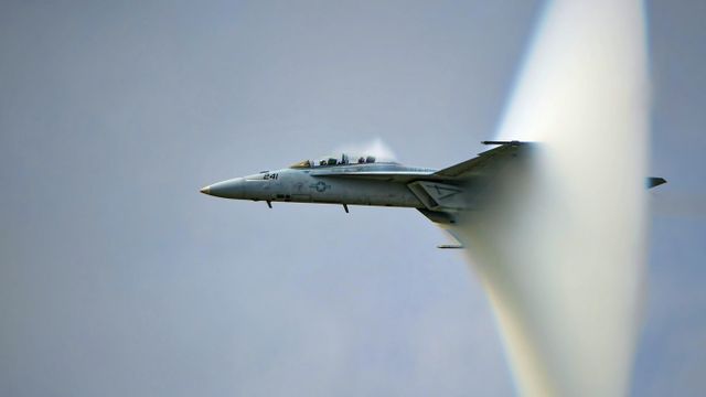 US Navy F/A-18F Super Hornet creating a sonic boom
