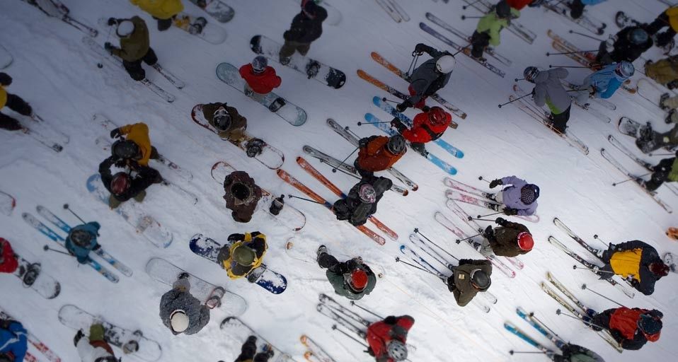 Skiers and snowboarders in lift line on Mt. Hood, OR