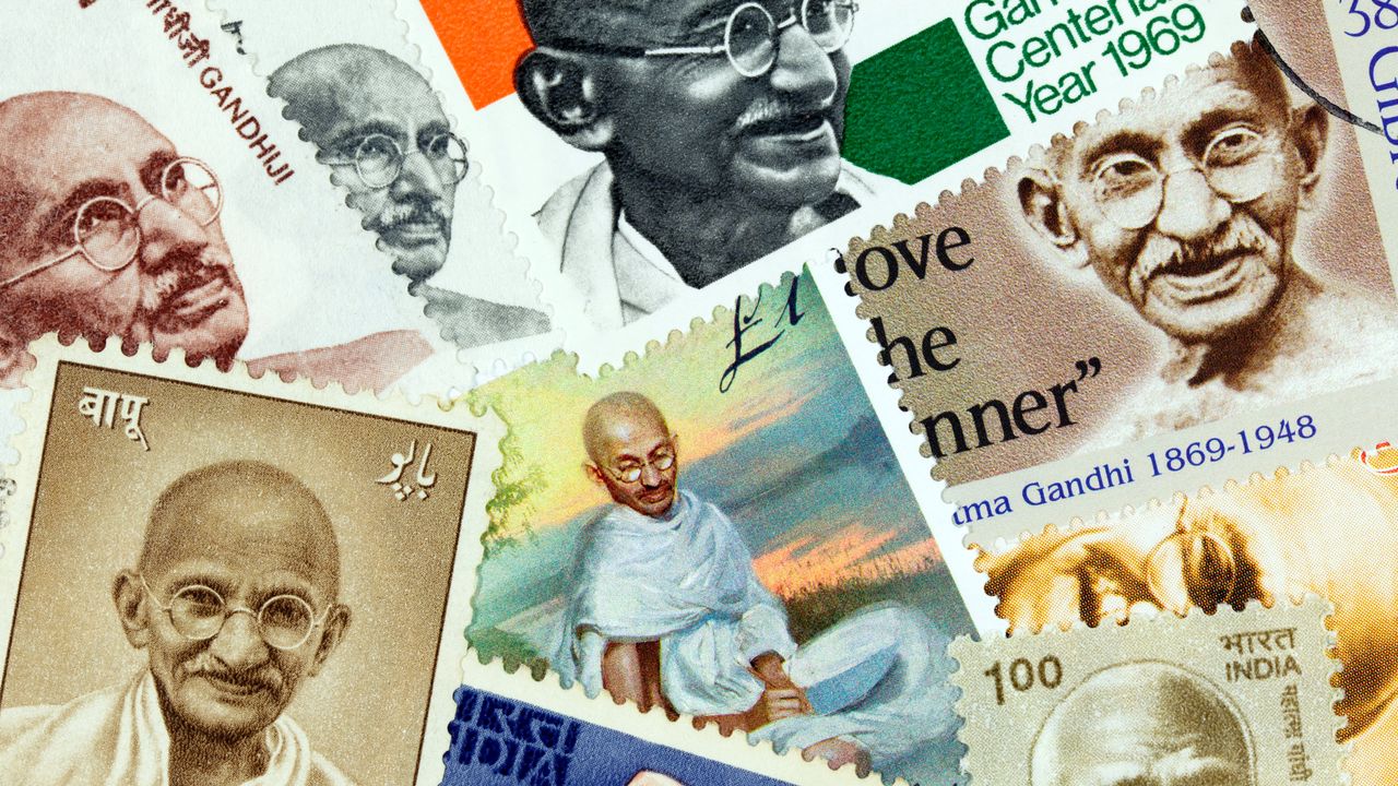 An assortment of postage stamps with images of Mahatma Gandhi
