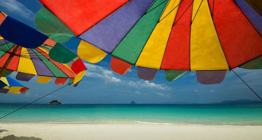 Umbrellas on a sunny beach in Southern Thailand