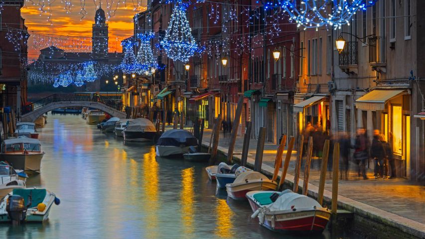Holiday decorations on a canal in Murano, Italy