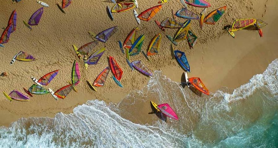 Ho'okipa beach covered with windsurfer boards, Maui, Hawaii, USA