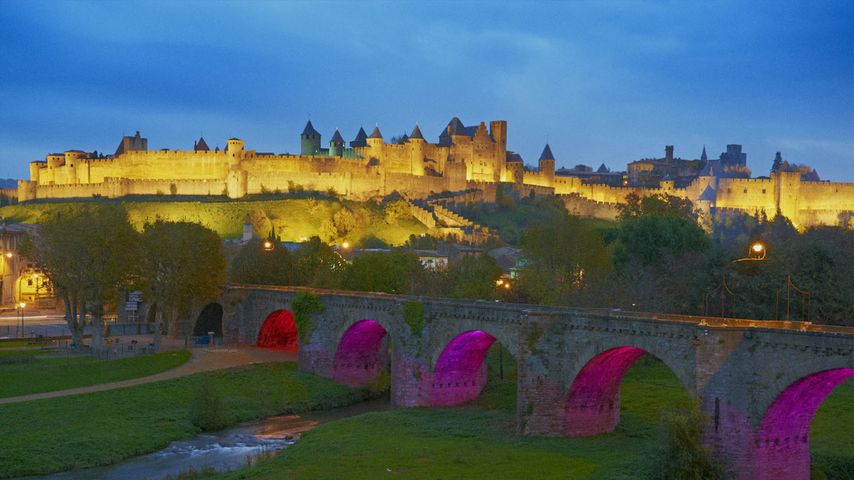 Carcassonne and the Pont Vieux bridge over the Aude River in Languedoc-Roussillon, France