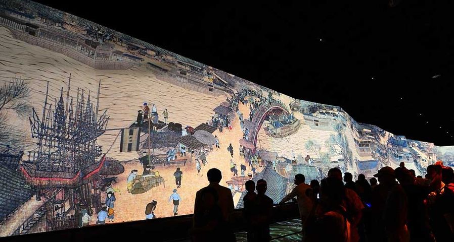 Visitors view the dynamic version of the famous Chinese picture "Riverside Scene at Qingming Festival" at the China Pavilion in the World Expo park in Shanghai, China