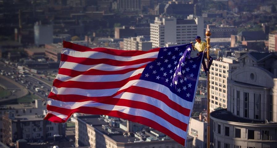 Flag rigger on flagpole, Boston, Massachusetts