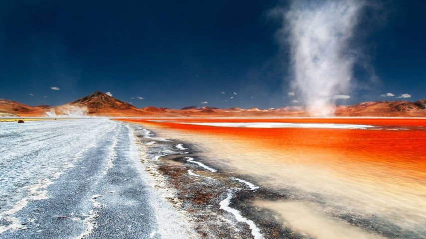 A dust devil swirls across Laguna Colorada in Bolivia 