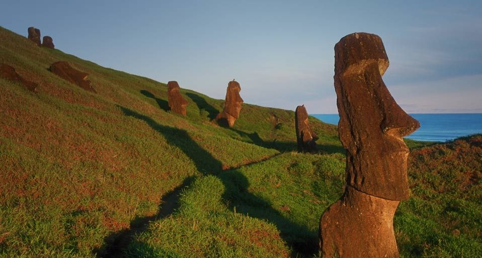 Moai stone statues on the outer slope of Rano Raraku, a soft stone quarry on Easter Island