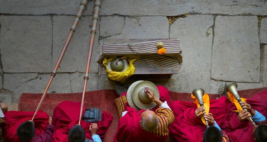 Musicians at a dance performance at the Thangbi Mani Festival in Bhutan - Keren Su/Getty Images ©