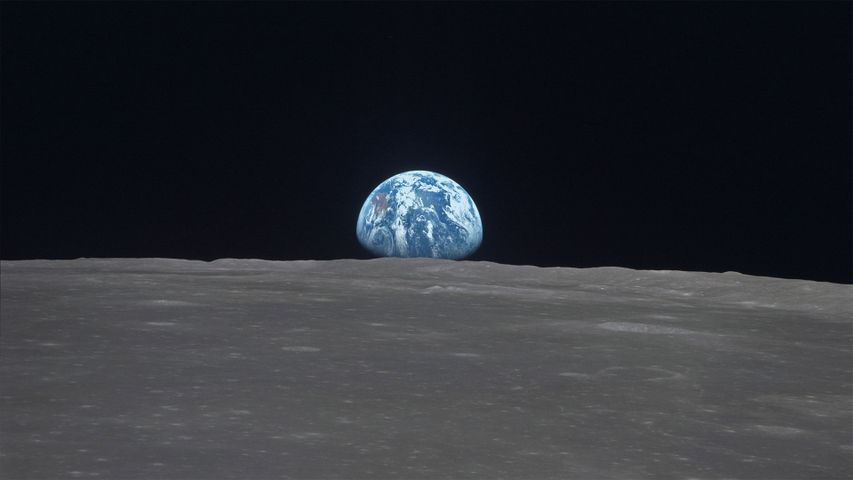 The Earth rises over Mare Smythii on the Moon