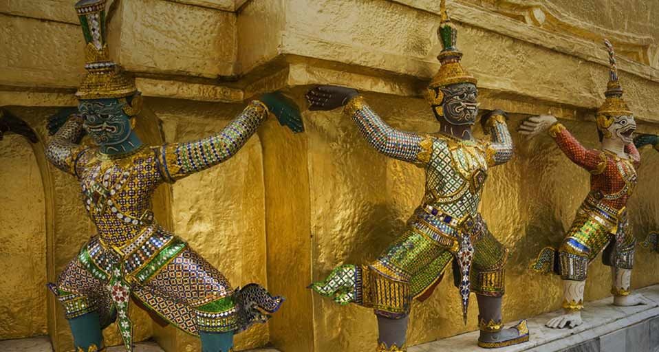 Mythical creatures guarding the golden chedi at the Grand Palace, Bangkok, Thailand