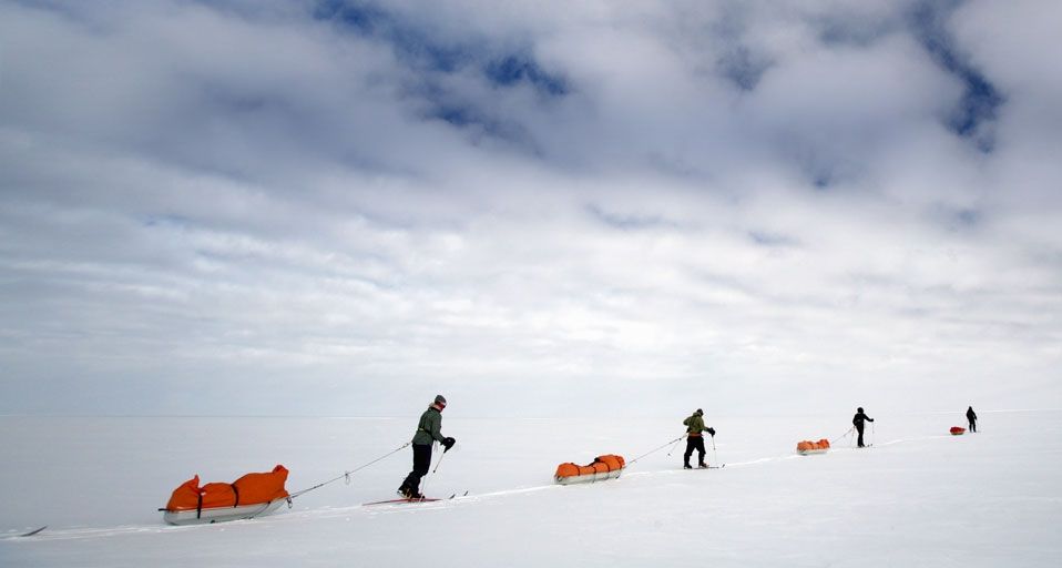 Skiers pulling sledges on route to South Pole, Antarctica