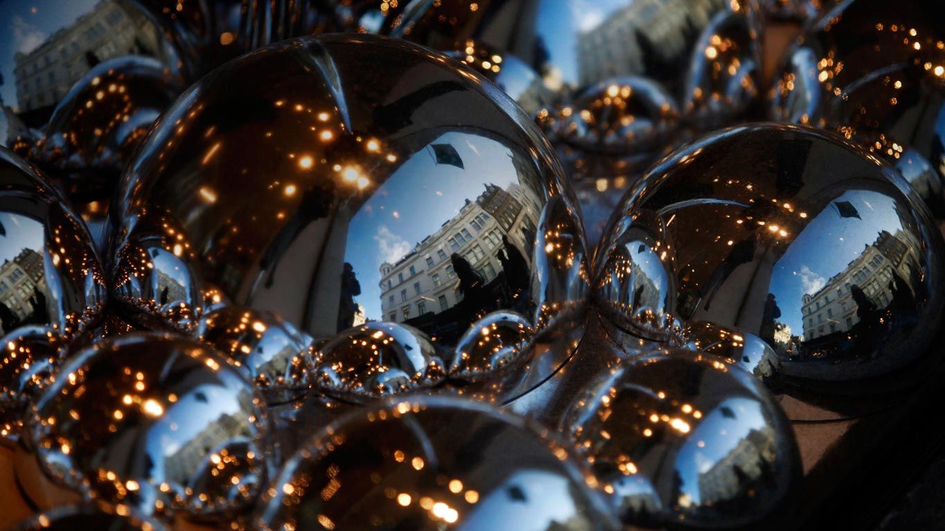 Luxury stores reflected in the Christmas window display of the Fenwick