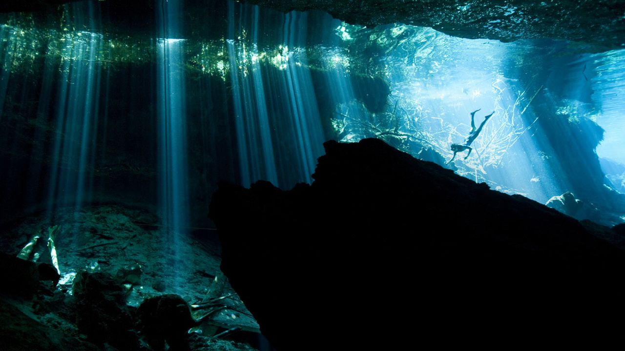 Diver in a cenote near Akumal, Mexico