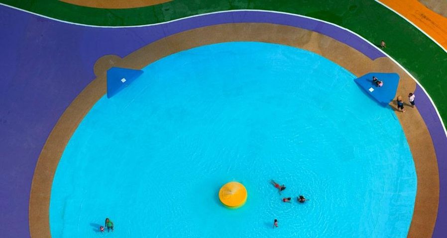 Colourful children's paddling pool in Watford, Hertfordshire, England