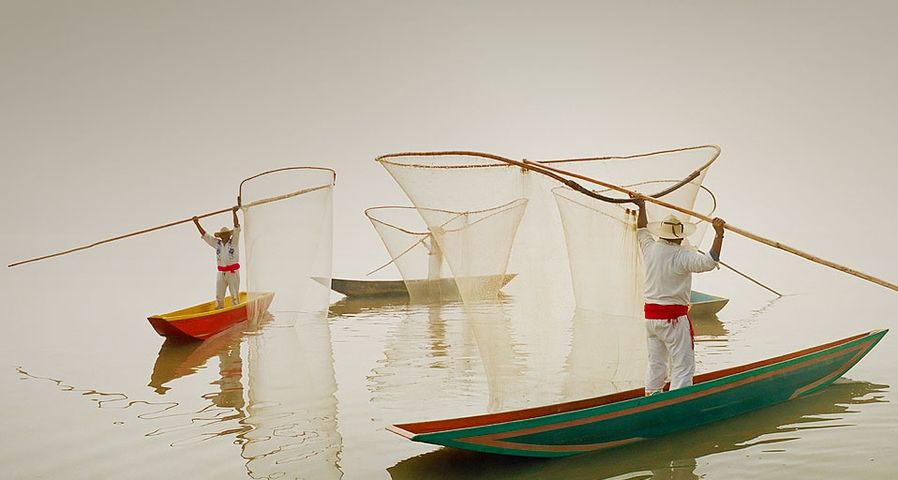 Fishermen using butterfly nets in Lake Patzcuaro, Michoacan, Mexico