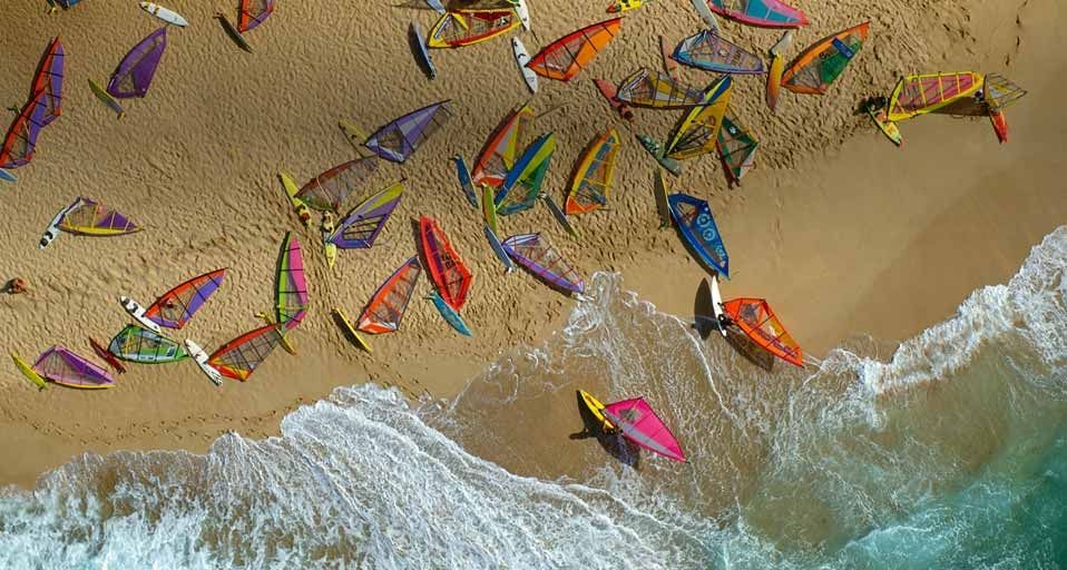 Ho'okipa beach covered with windsurfer boards, Maui, Hawaii