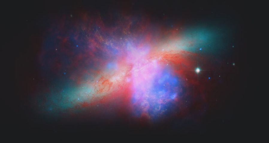 NASA's Spitzer, Hubble, and Chandra space observatories teamed up to create this view of the M82 galaxy