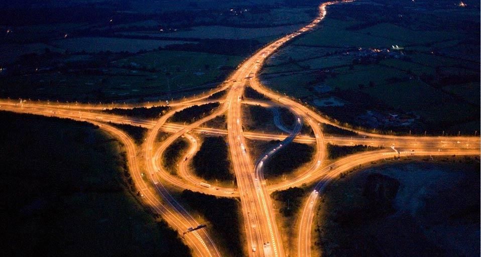 Junction of the M25 and M11 motorways at night, Essex, England