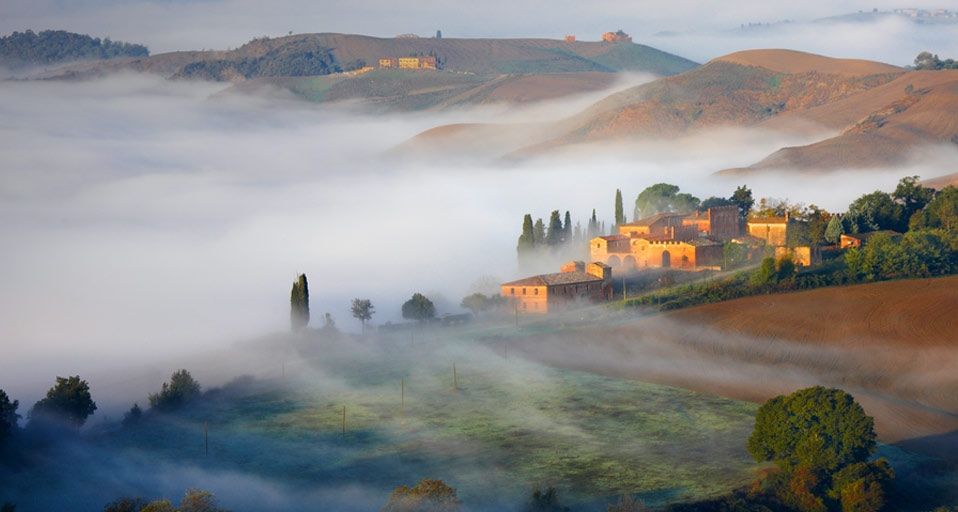 Early morning fog in Crete Senesi, Italy