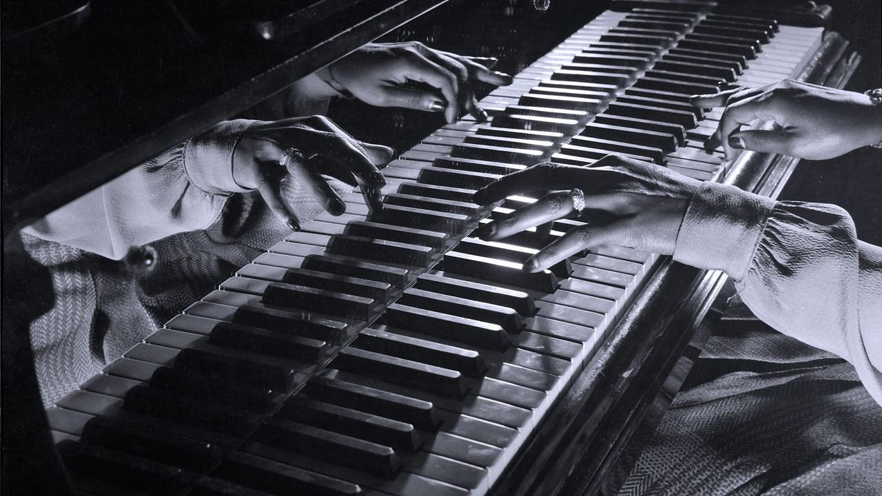 Close-up of the hands of jazz pianist Mary Lou Williams during a jam session held in New York City, USA, 1943 