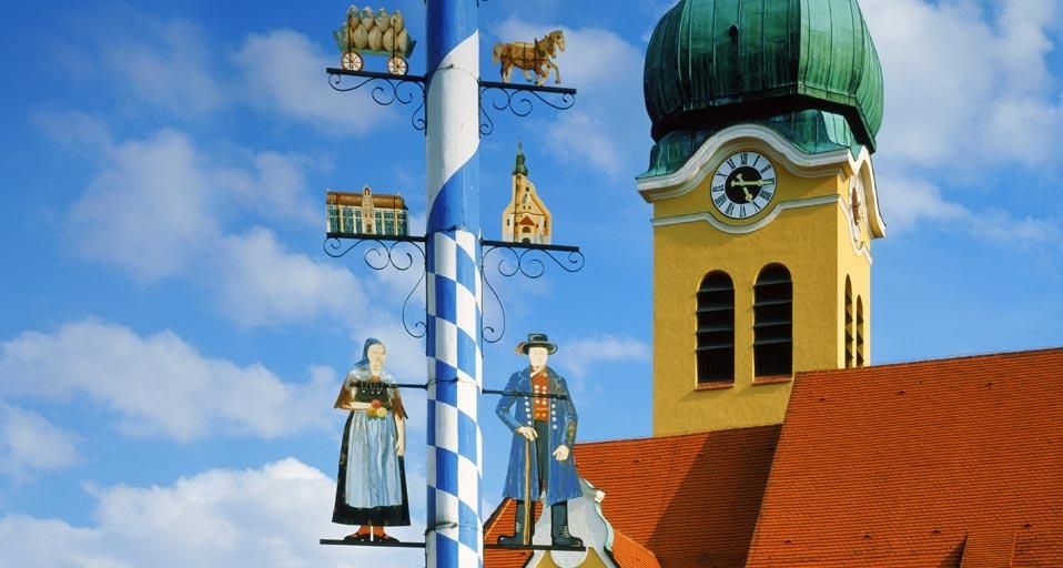 Maypole in front of a church in Wolnzach, Bavaria, Germany