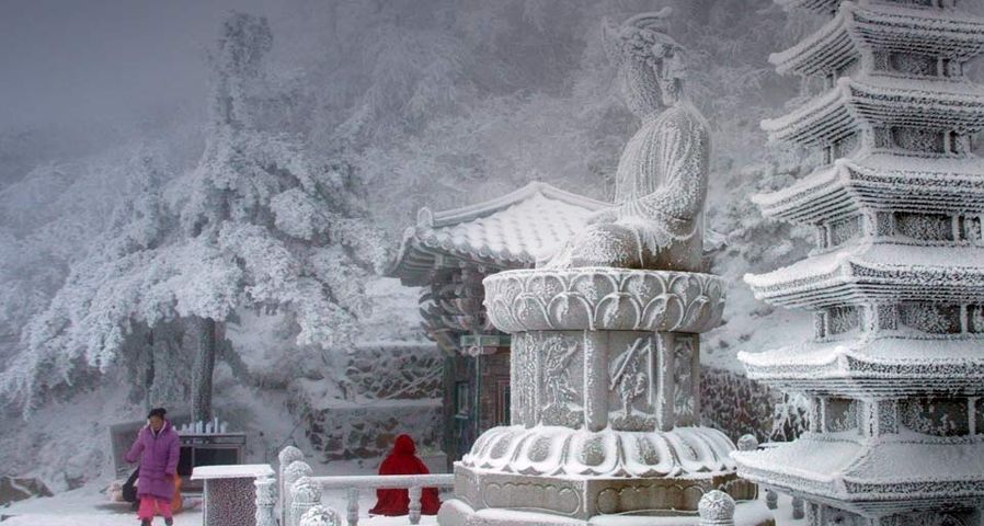 Snow blankets a temple on a mountain in South Korea's eastern Gangwon Province