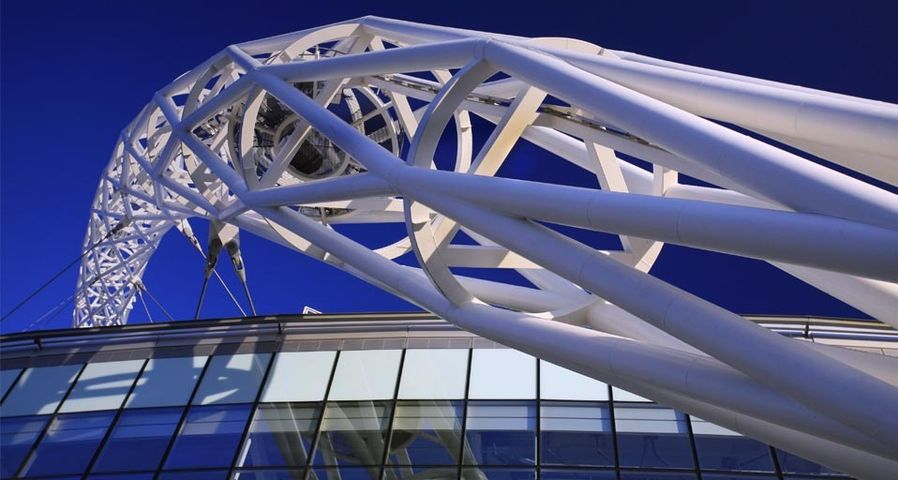 The steel arch of Wembley Stadium in the evening sun, London, England