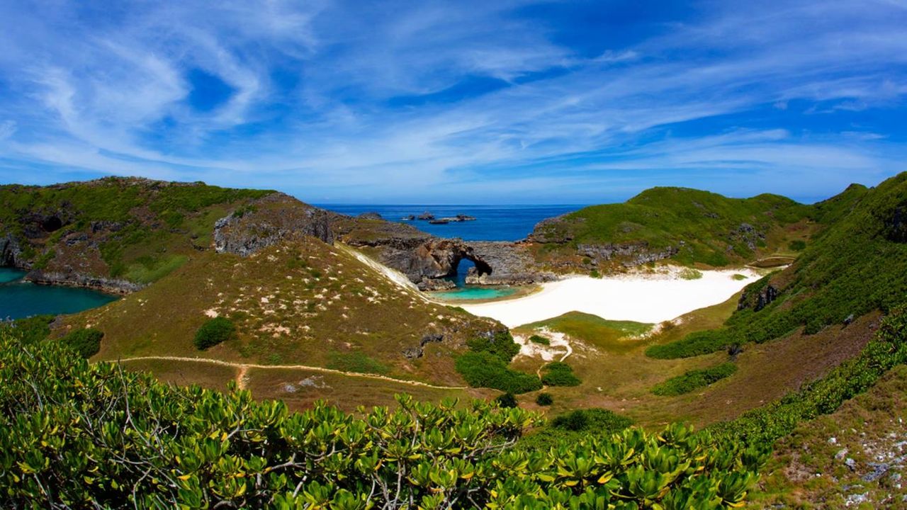 Sea cave and coral sand beach of South Iwo Jima Island (Minami-Iōtō), Japan
