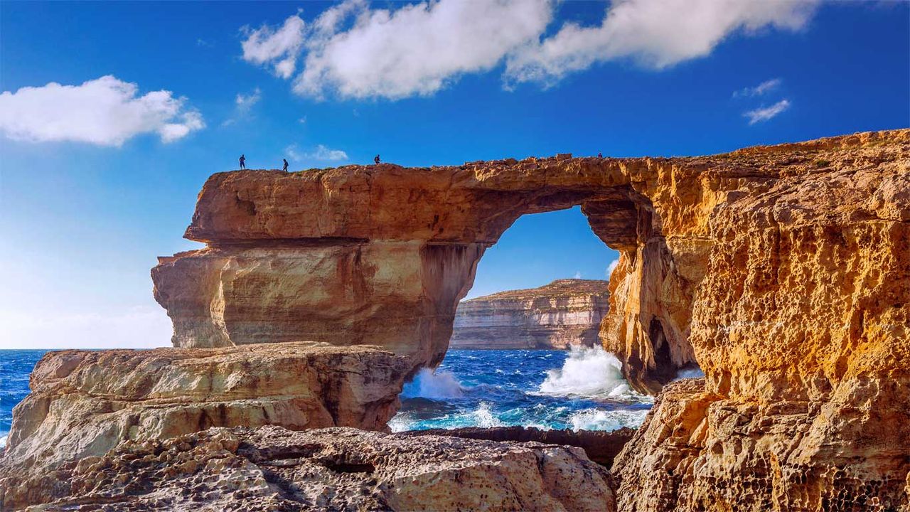 The Azure Window natural stone arch near Dwejra Beach, Gozo, Malta 
