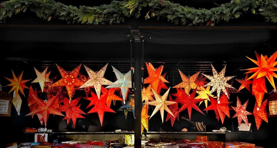 Luminous stars decorations in stall at the Christmas Market at the Town Hall in Munich, Germany