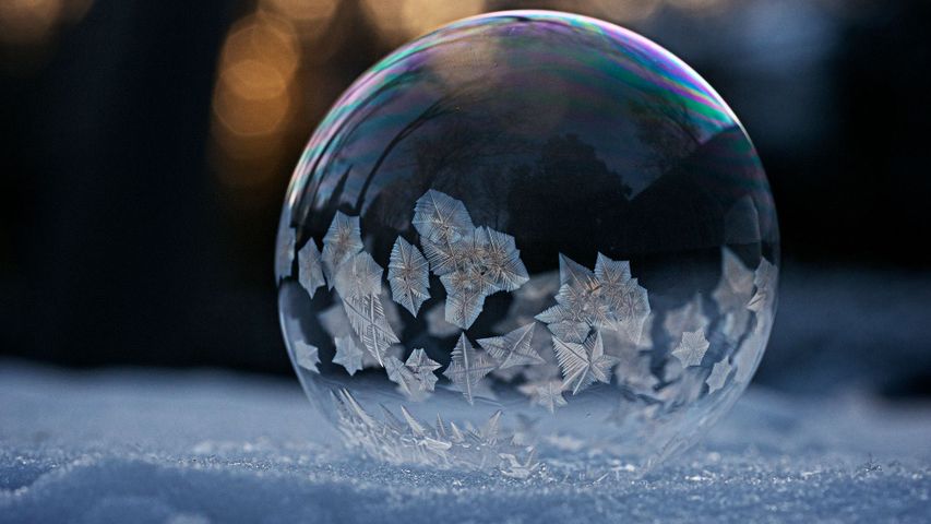 A macro shot of a frozen soap bubble on snow, Montreal