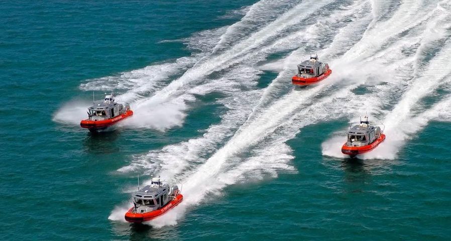 Four 25-foot response boats return to Coast Guard Station St. Petersburg in St. Petersburg, Florida