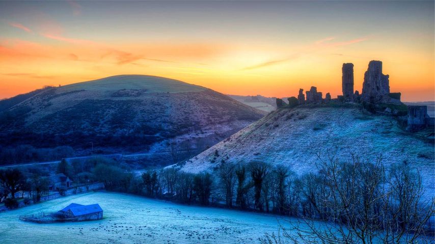 Colourful sunrise over Corfe Castle, United Kingdom