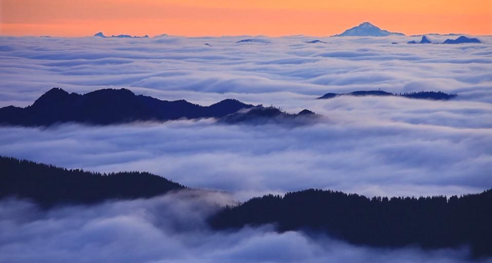 Fog over Spray Park in Mount Rainier National Park with Glacier Peak in the background, Washington