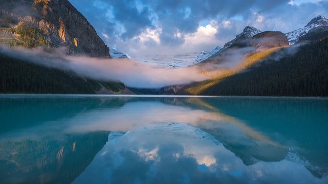 A foggy morning at the iconic Lake Louise in Alberta 