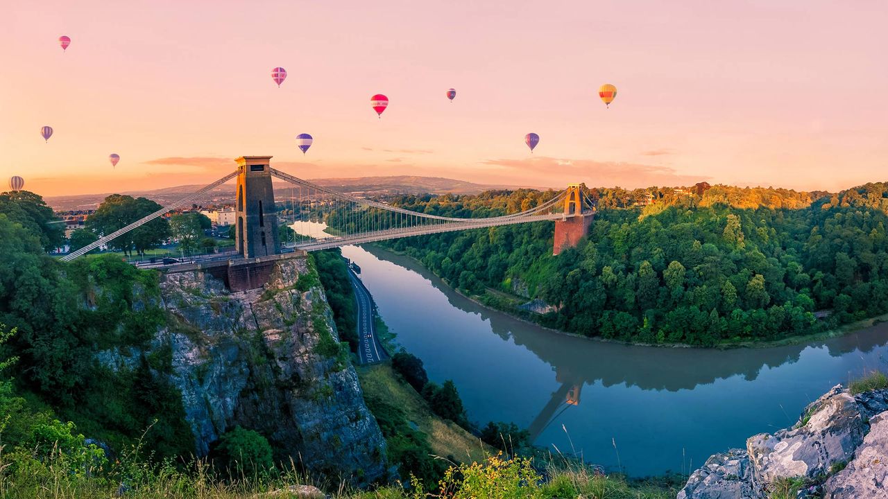 Hot air balloons over Clifton Suspension Bridge at sunrise, Bristol