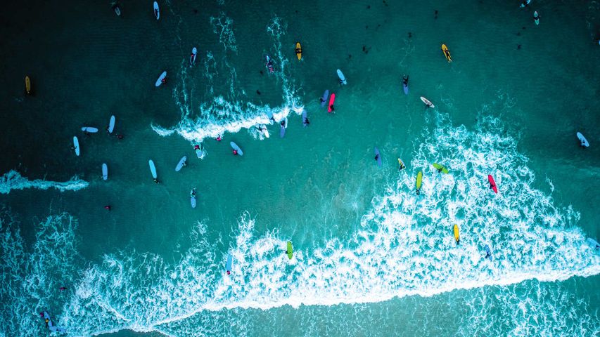 Aerial view of surfers in Cornwall for International Surfing Day