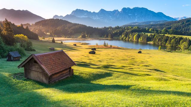 Sunlit huts and Geroldsee, Bavarian Alps, Germany